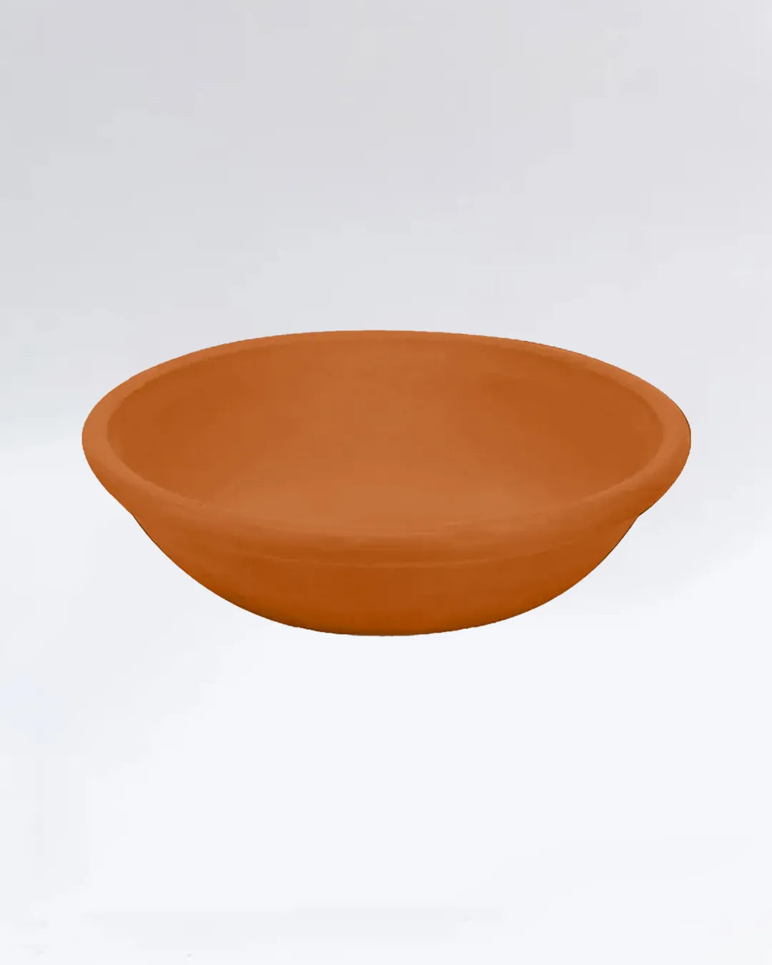 Terracotta bowl on a white background