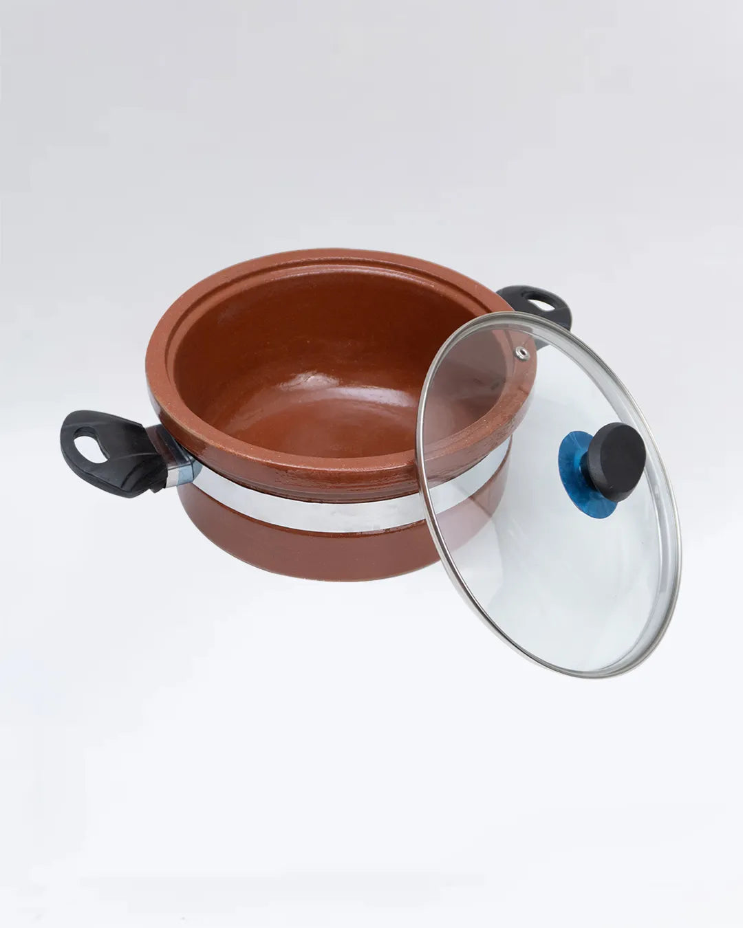 Ceramic pot with a glass lid on a white background
